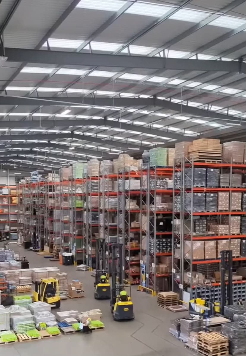 Pallet racking and forklifts on a distribution warehouse floor